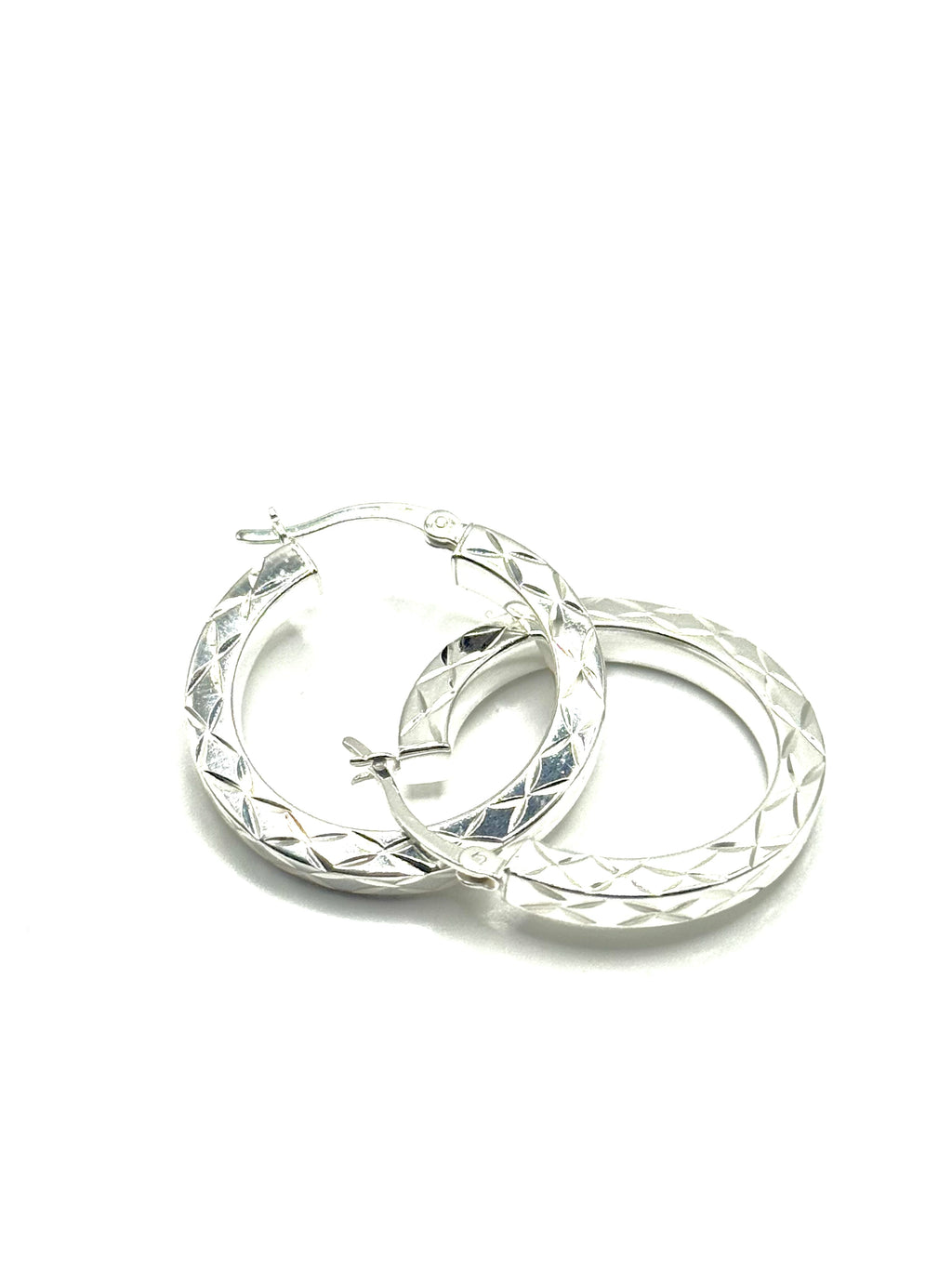 Woman’s diamond cut hoops