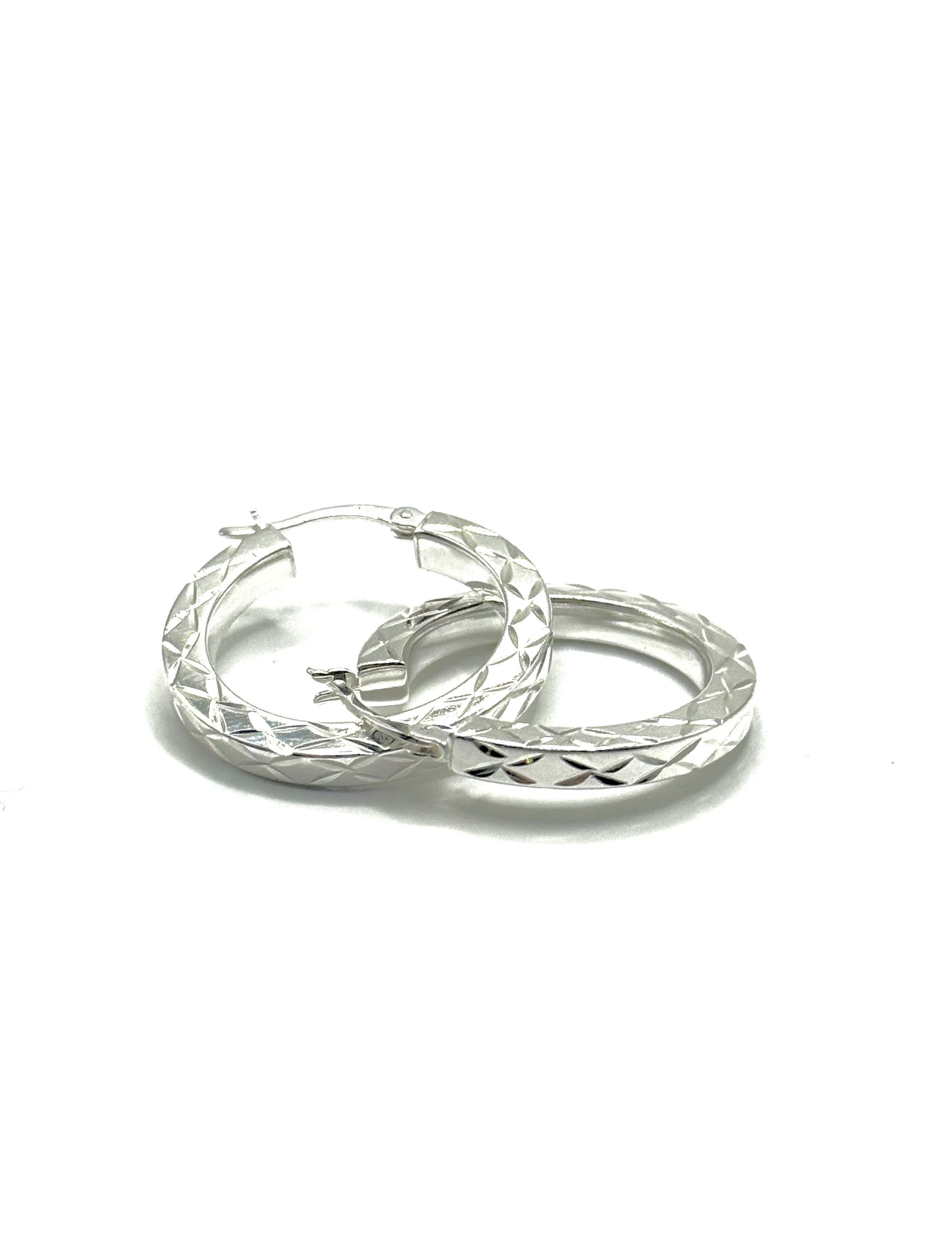 Woman’s diamond cut hoops