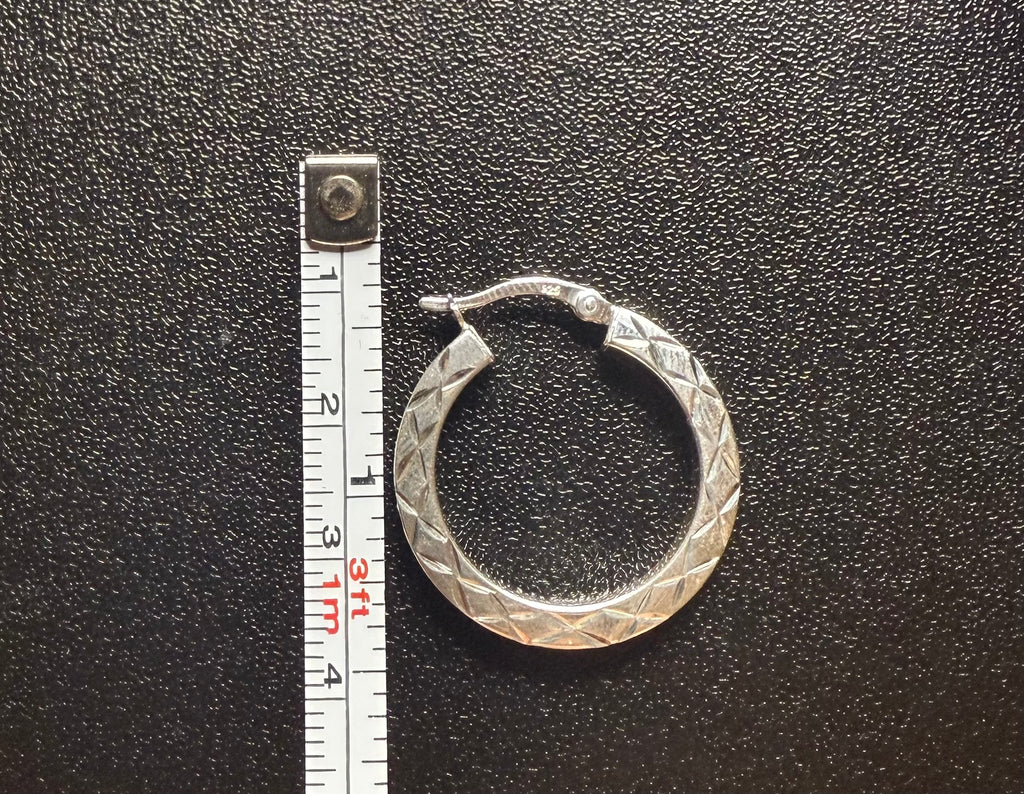 Woman’s diamond cut hoops