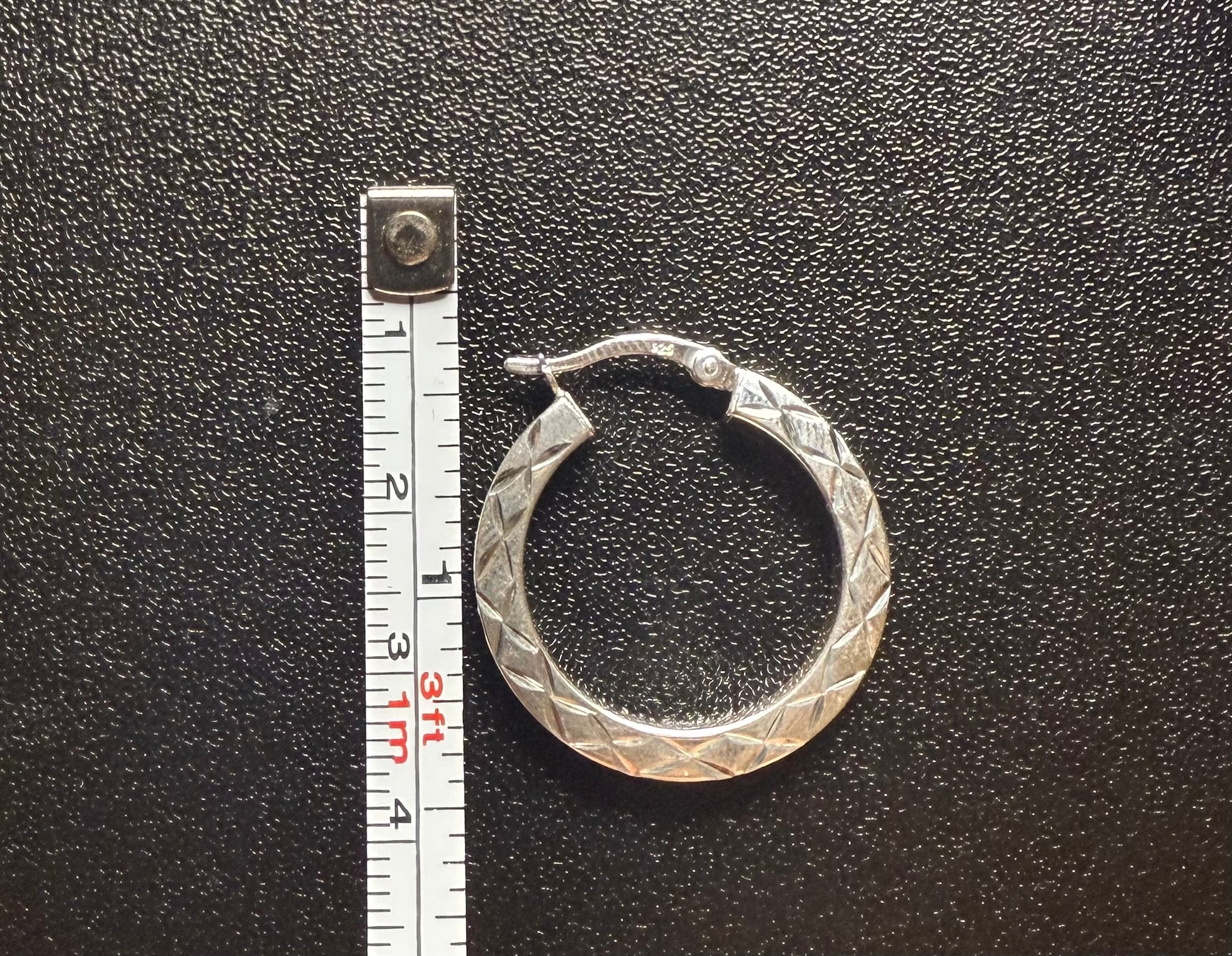 Woman’s diamond cut hoops