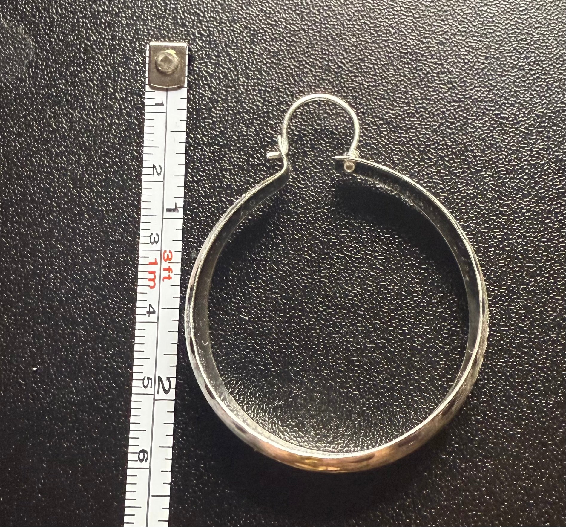 Woman’s hoop earrings