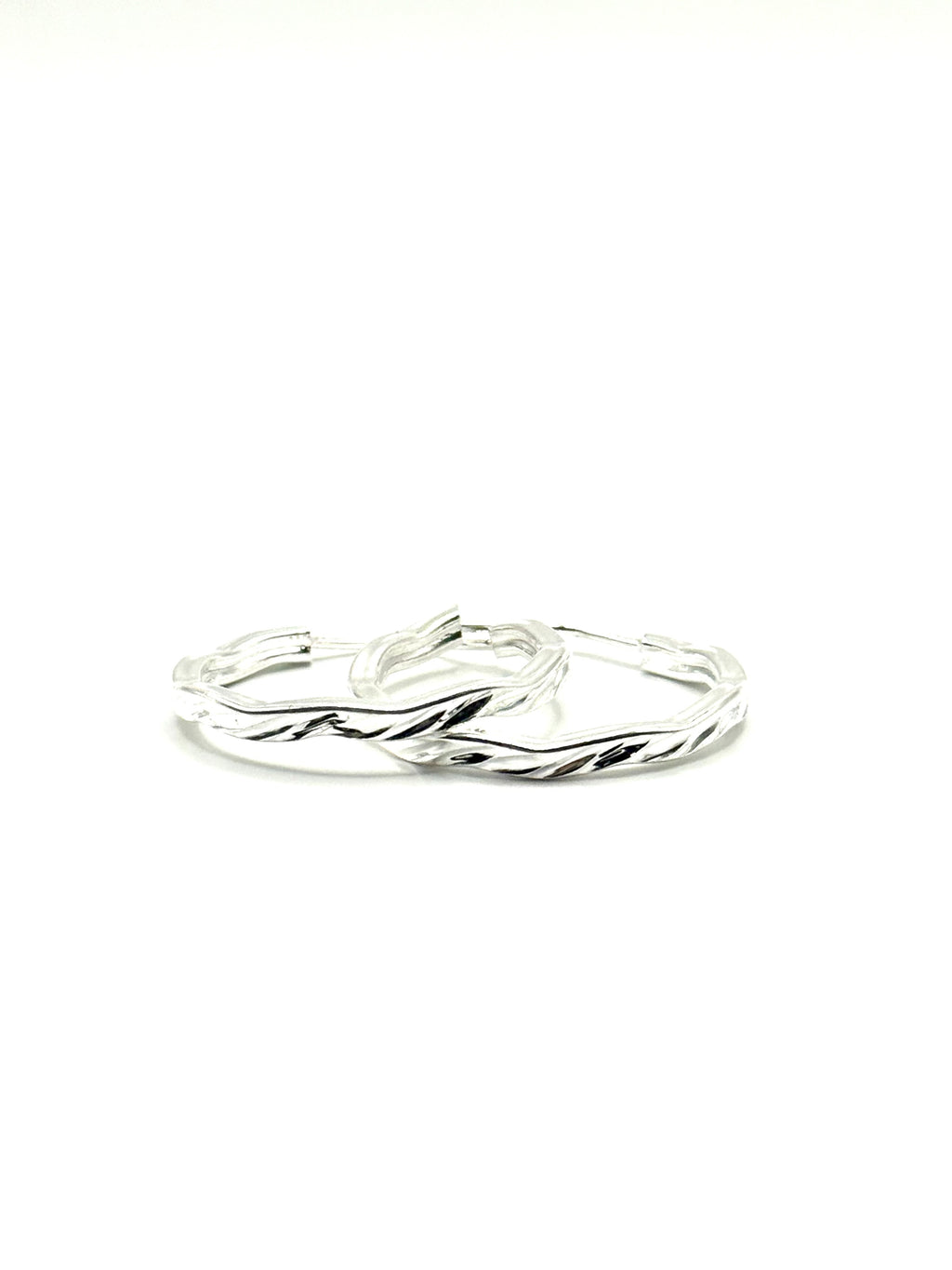 Woman’s slim hoop earrings