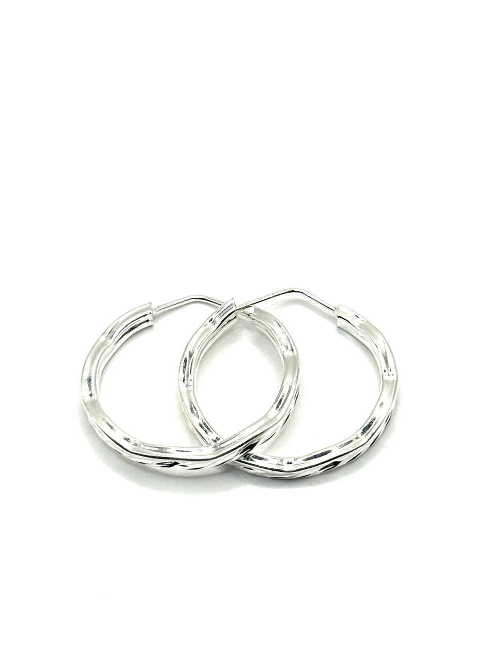 Woman’s slim hoop earrings