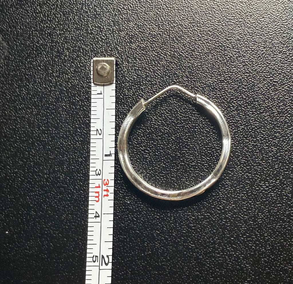 Woman’s slim hoop earrings