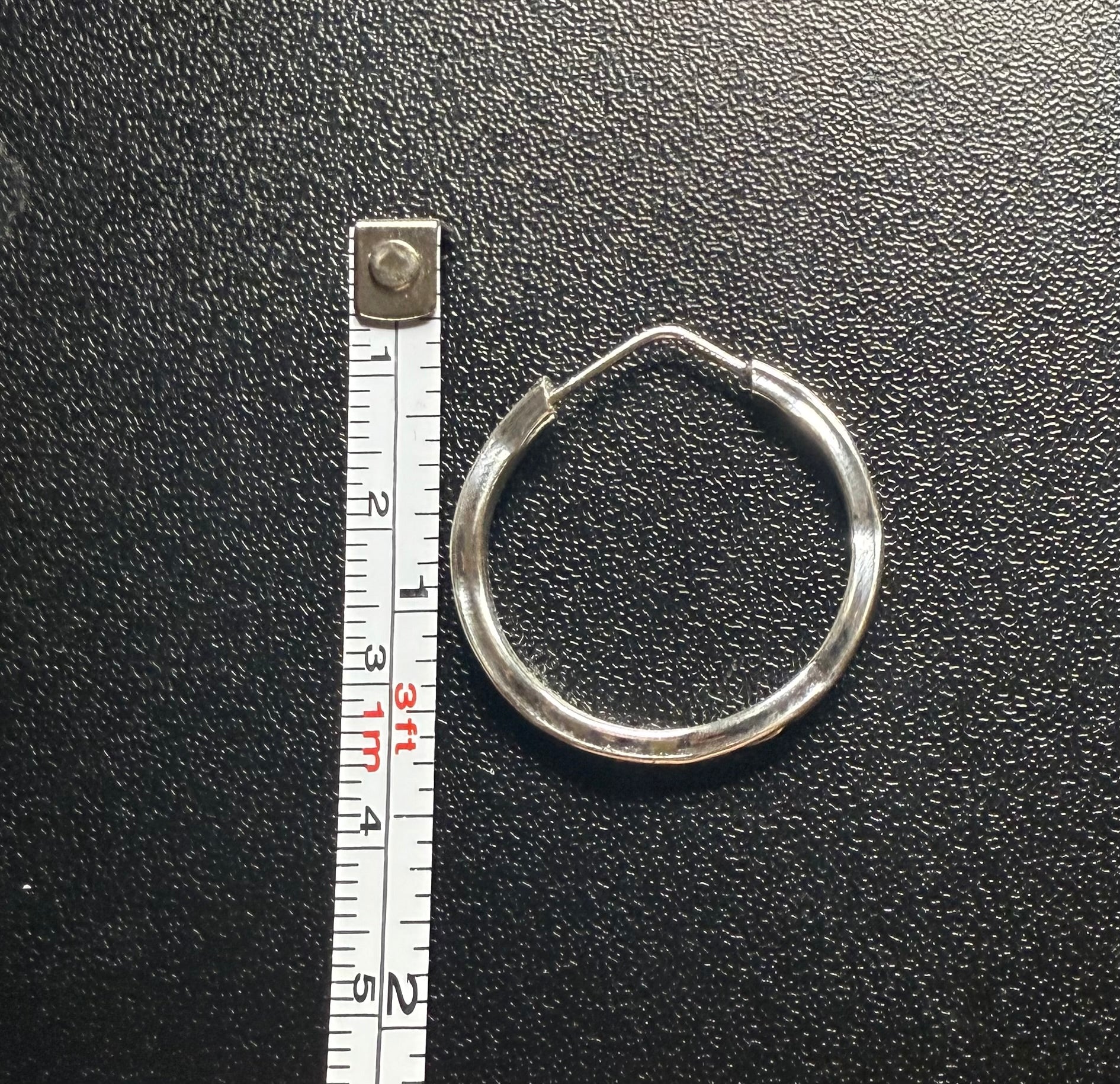 Woman’s slim hoop earrings