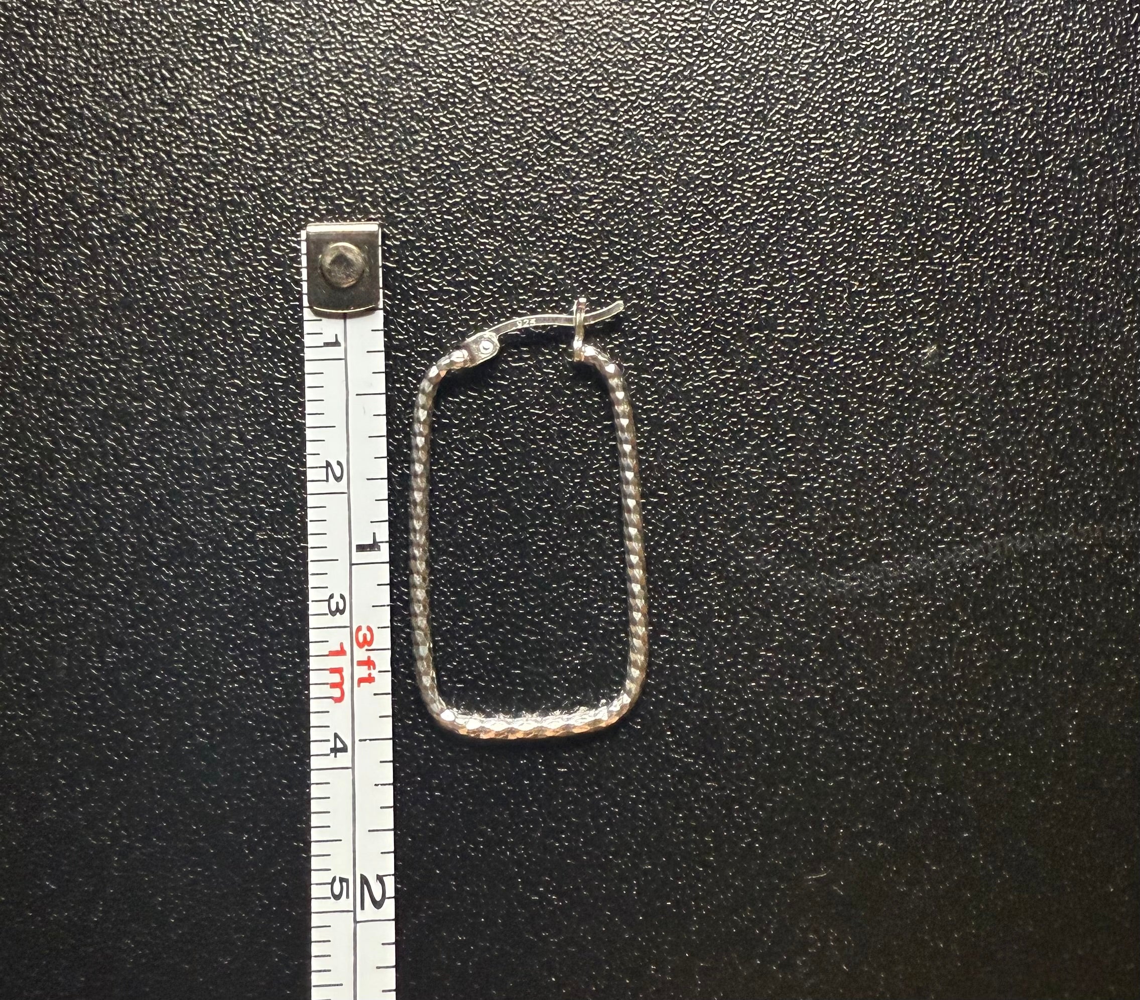 Woman’s rectangular hoop earring’s