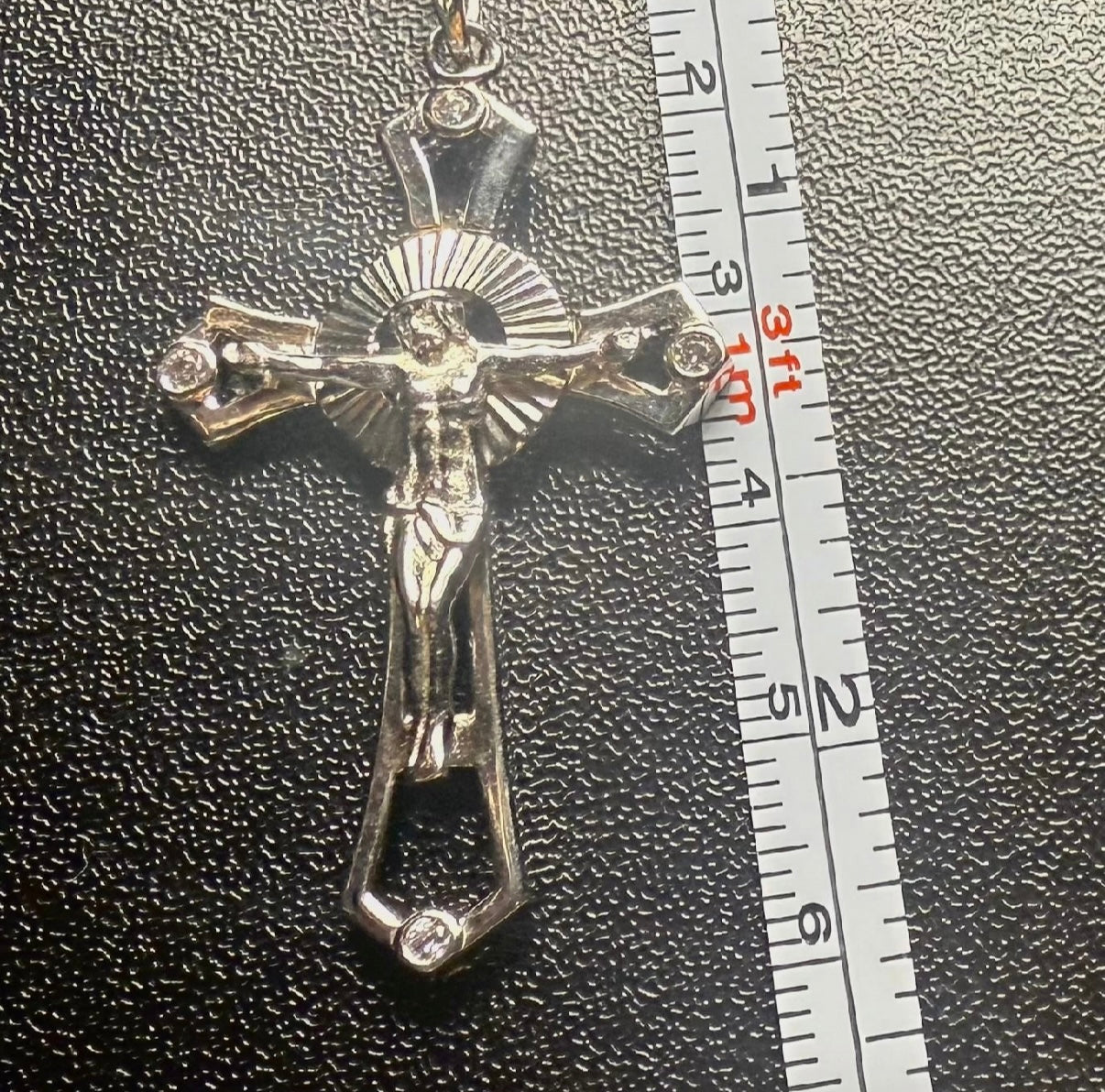 Silver cross with bezel setting